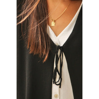 CHALECO DE PUNTO NEGRO NUDO